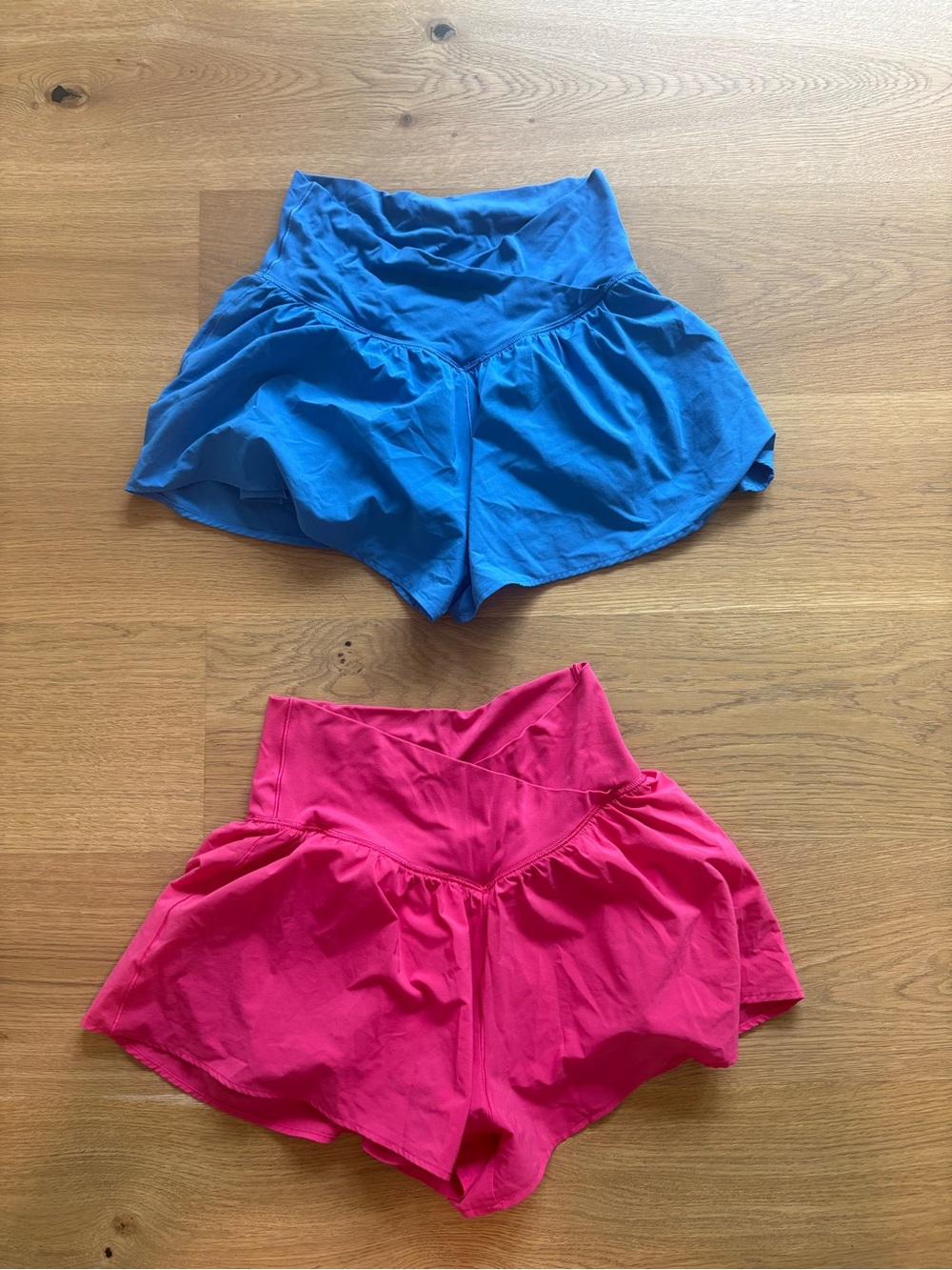 aerie Cross Over Athletic Shorts Duo in Blue and Pink